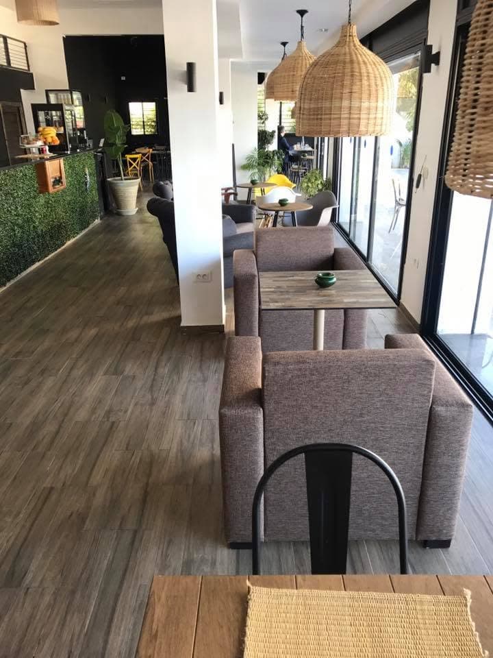 The room in a line, grey armchairs and a wooden floor